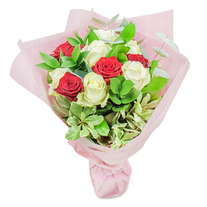 Illuminated by soft, diffuse daylight, this spectacular bouquet captures the essence of skilled floristry in Leamouth. It features twenty premium roses at their freshest-ten in classic red, ten in snow-white-each bloom expertly spaced and angled to create a gentle wave of colour throughout the bouquet. The arrangement's lush foundation includes deep green Ruscus, rounded leaves with cooler tones, and sprigs of eucalyptus, all lending structure, texture, and a subtle, calming fragrance. Careful placement of variegated, cream-edged foliage adds brightness and movement, conjuring the lively, eclectic energy of Leamouth's riverside parks and creative enclaves. Swathed in multiple layers of sheer, softly blushing pink paper, the bouquet's presentation is at once modern and timeless, its neat tie hinting at both order and whimsy. The overall feel is celebratory, elegant, and deeply heartfelt-a perfect emblem for anniversaries, thank yous, or new beginnings near Poplar or the mouth of the River Lea. This carefully crafted composition embodies the unique charm of Leamouth, combining purity, passion, and the artistry for which local florists are known.